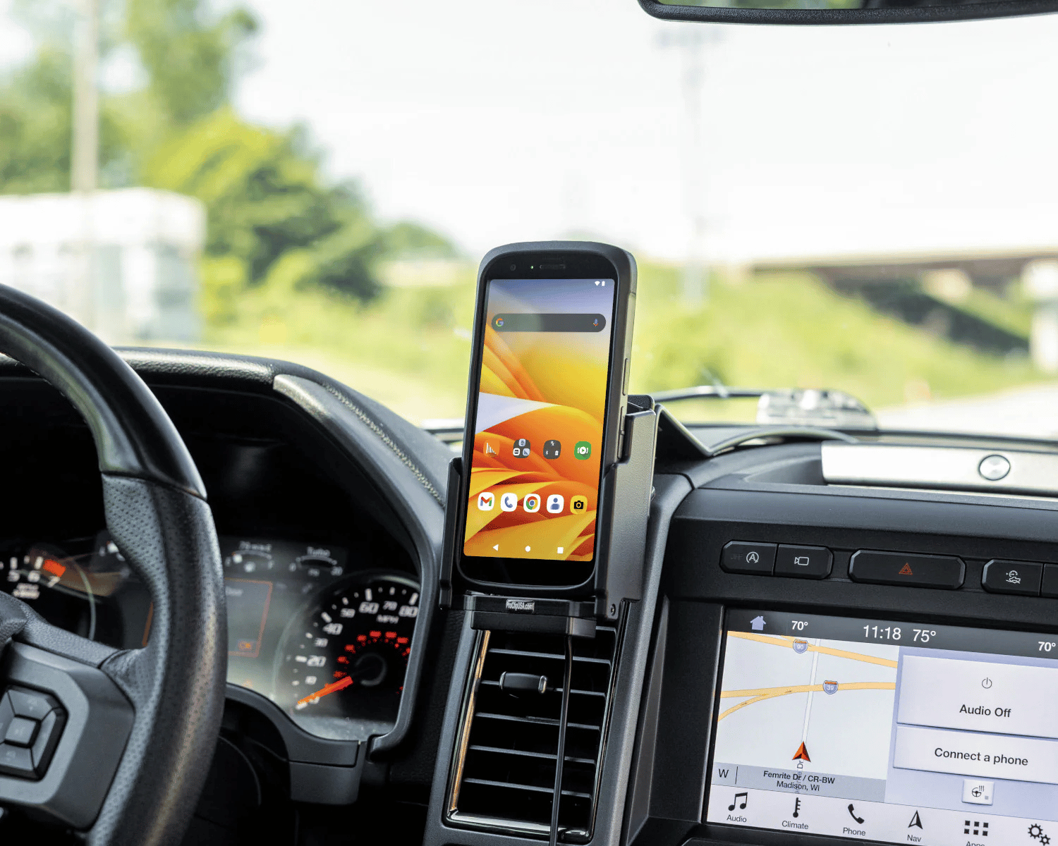 Device mounted securely on a van dashboard